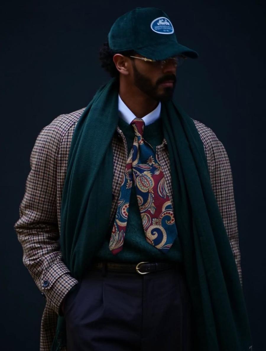 Houndstooth coat with green scarf